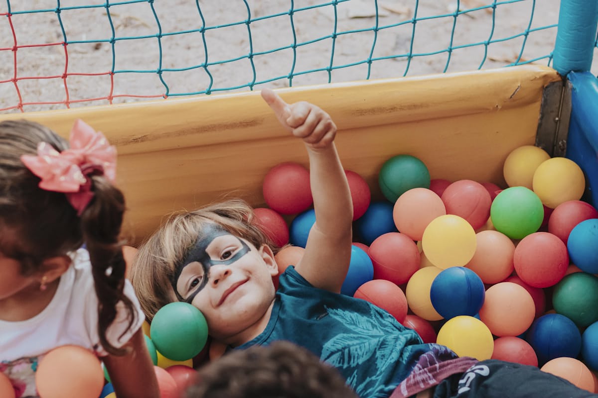 child in ball pit